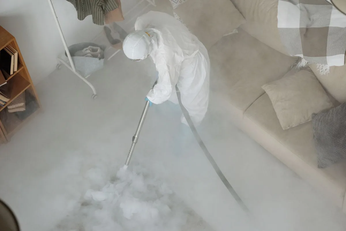 Biohazard cleanup technician in protective equipment, Rustburg, VA